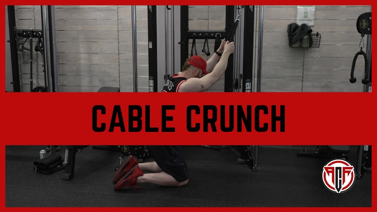 Person performing a kneeling cable crunch using a rope attachment on a high pulley machine, curling their torso forward with the rope held beside their head to target the abdominal muscles.