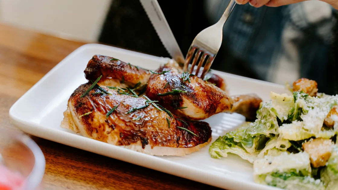 Roasted chicken served with a green salad as part of a protein-rich meal.