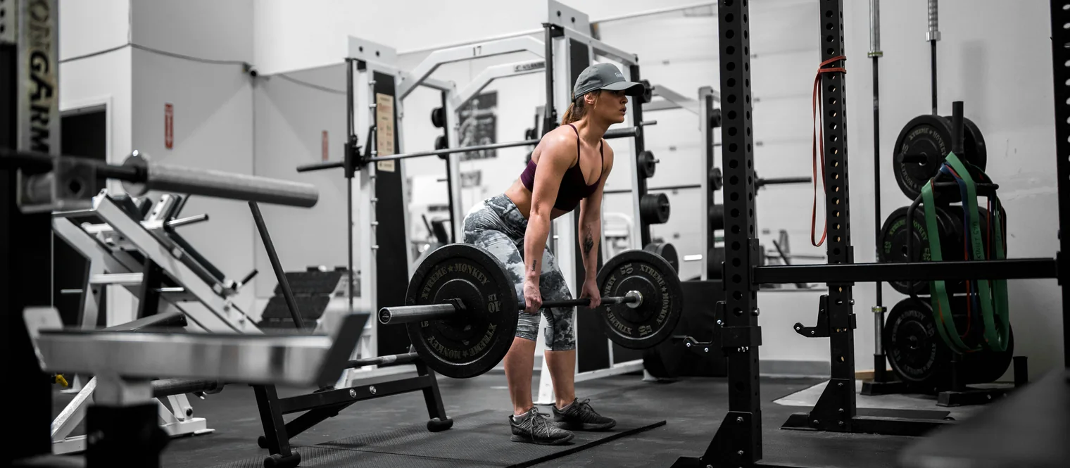 Woman performing a Romanian Deadlift