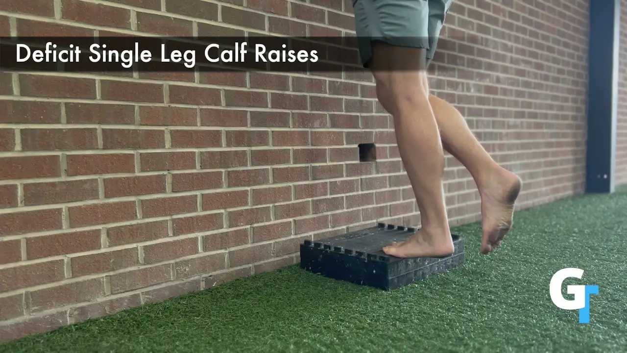 Person performing a single-leg calf raise on a raised platform, balancing on one foot with the heel lifted and the other leg bent behind, demonstrating the calf-strengthening exercise.