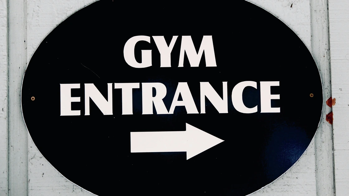 A sign that reads Gym Entrance to the right.